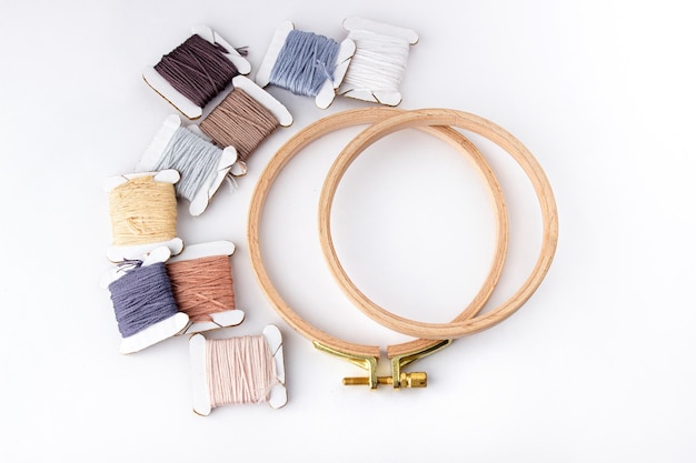 Assorted colorful embroidery threads and hoops